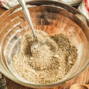 Pot roast seasoning in a mixing bowl with a spoon.