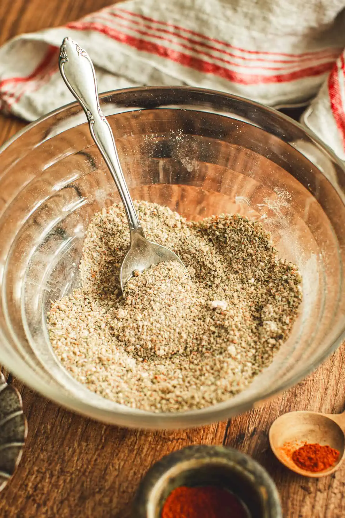 Pot roast seasoning in a small mixing bowl with a silver spoon.