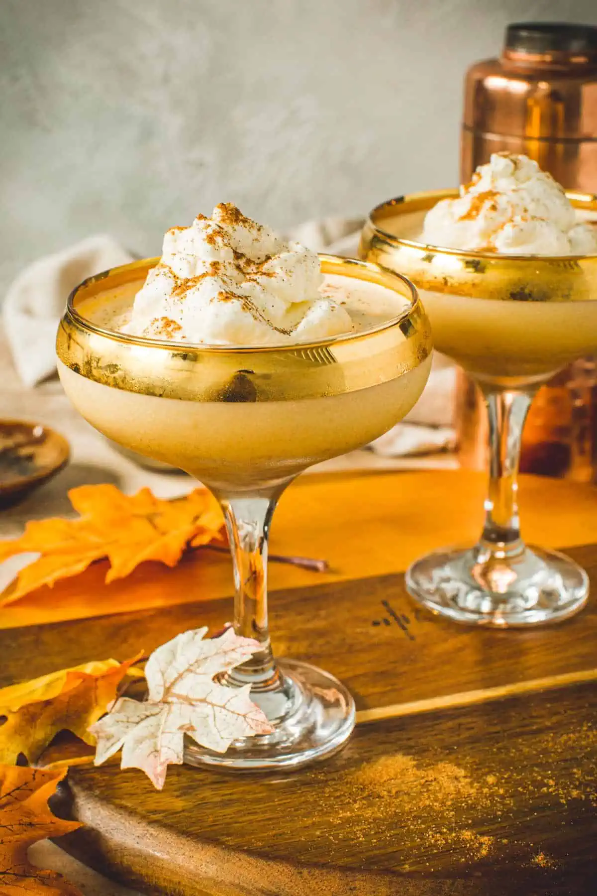 Pumpkin Pie Martini topped with whipped cream and pumpkin pie spice.