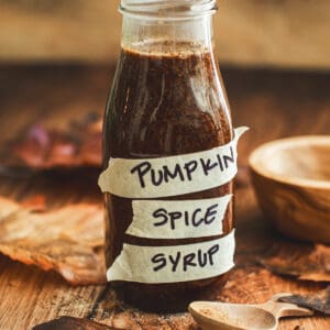 Pumpkin spice syrup in a bottle with a label that says "pumpkin spice syrup".