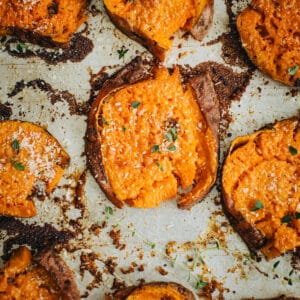 Smashed sweet potatoes topped with fresh thyme.