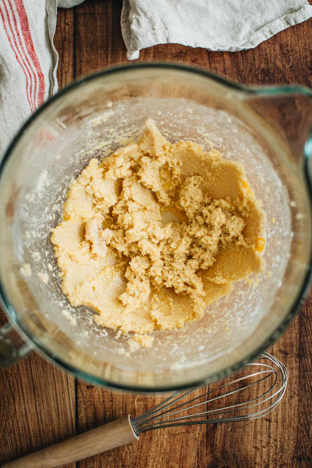 Wet ingredient mixture in a mixing bowl for making turtle cookies.