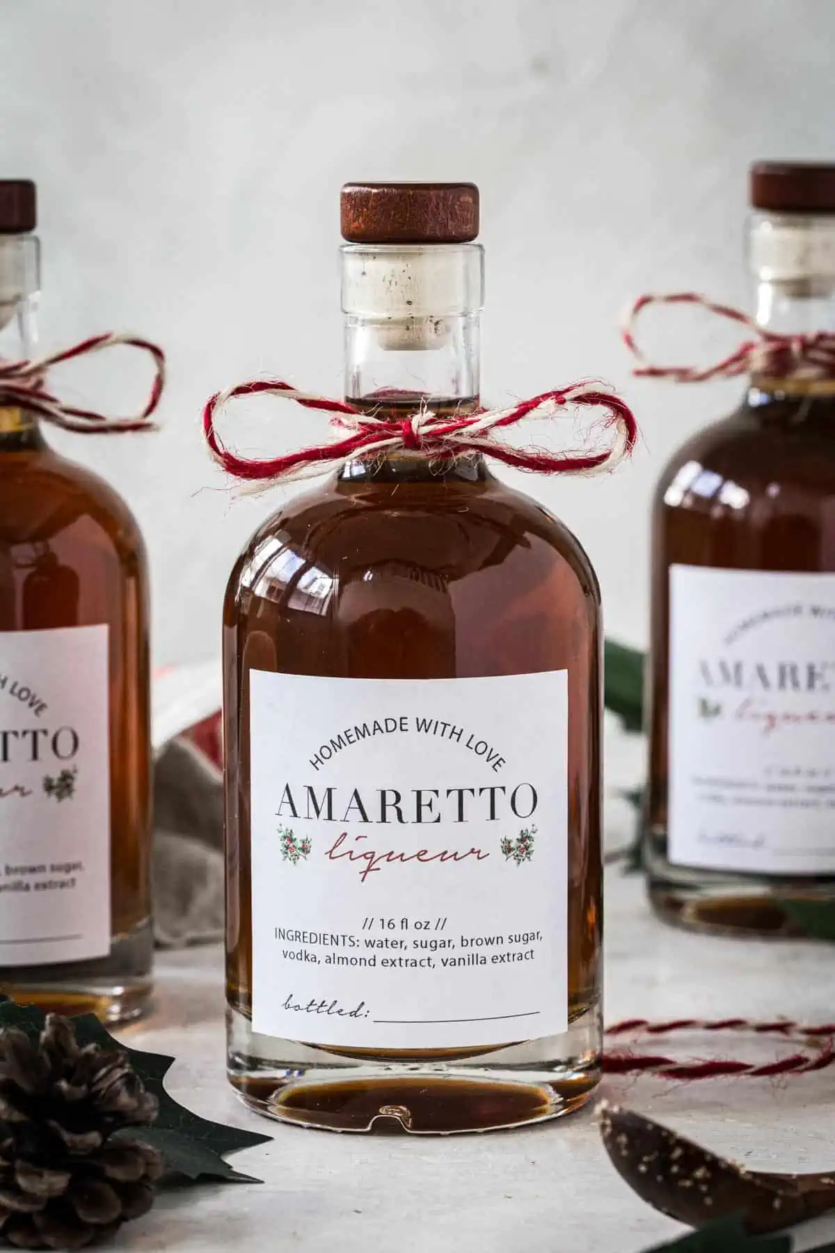 Homemade amaretto in a bottle with a homemade label.