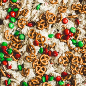 Christmas Chex mix with mini pretzels, M&M's, and crushed candy canes.