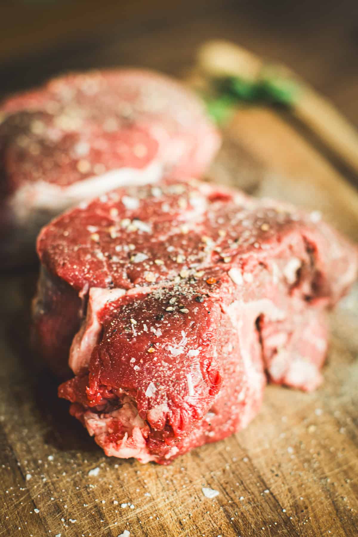 Tenderloin beef filets coated in salt and pepper ready for cooking.