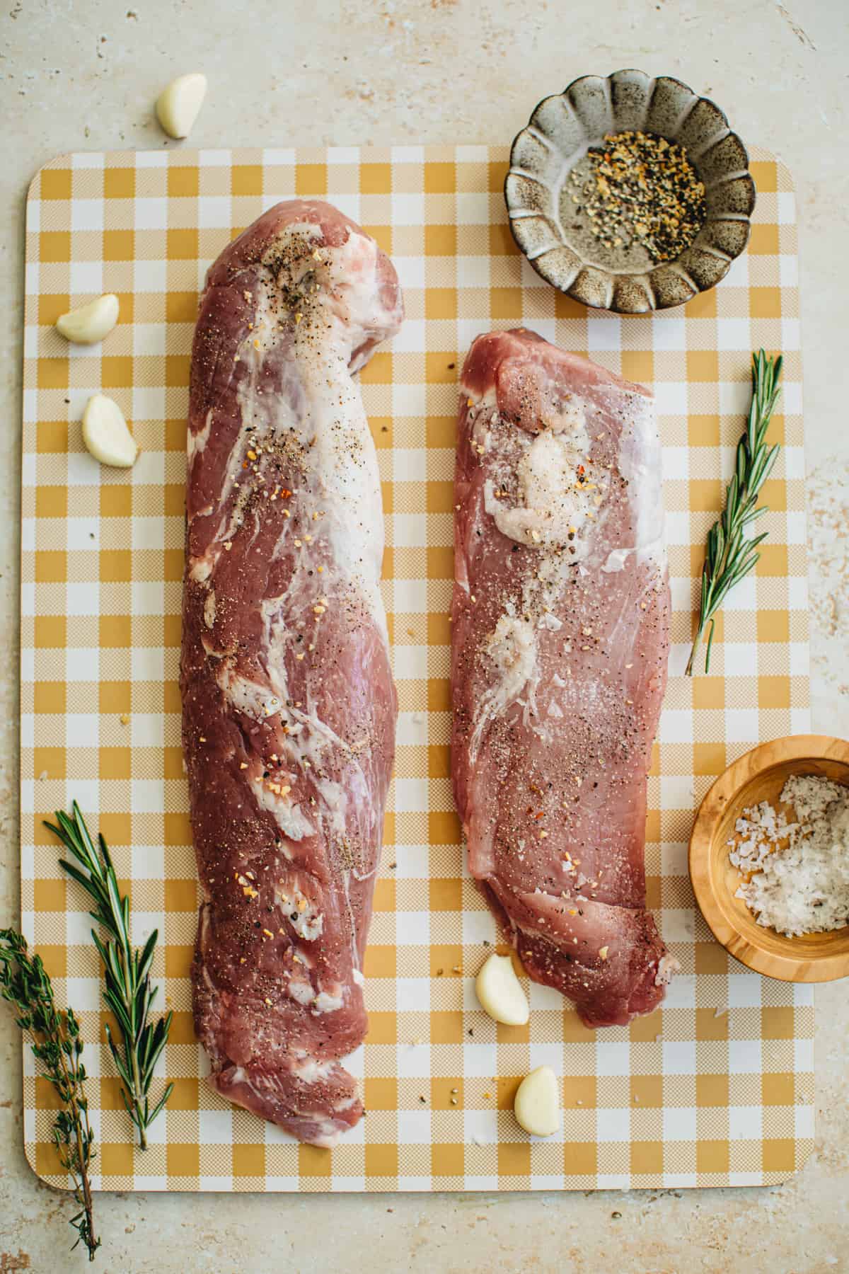 Seasoned pork tenderloin ready to be bagged for sous vide cooking.